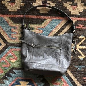 Gray leather purse by The Sak